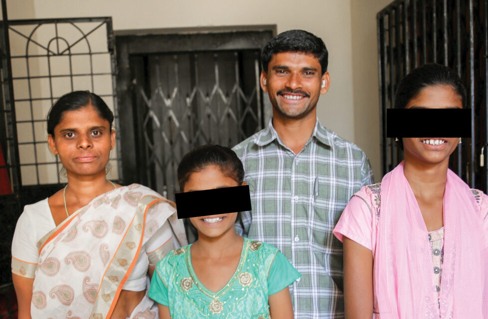 A family looking at the camera and smiling
